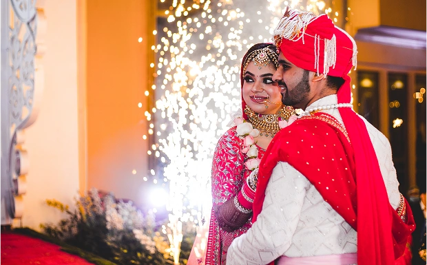 Bride and groom with cold pyro fountains at NS Convention, an event venue in Madhapur