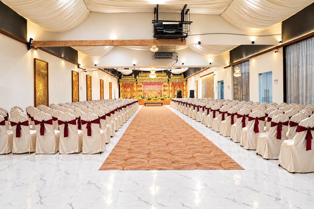 NS Convention main hall with white chair rows and a carpeted aisle to the wedding stage