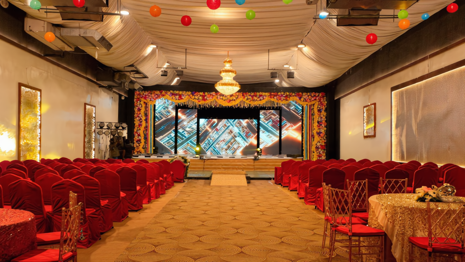 NS Convention Main Hall 5 NS Convention main hall with red chairs, round tables and an LED stage