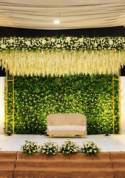 Green floral backdrop and white sofa on the NS Convention wedding stage